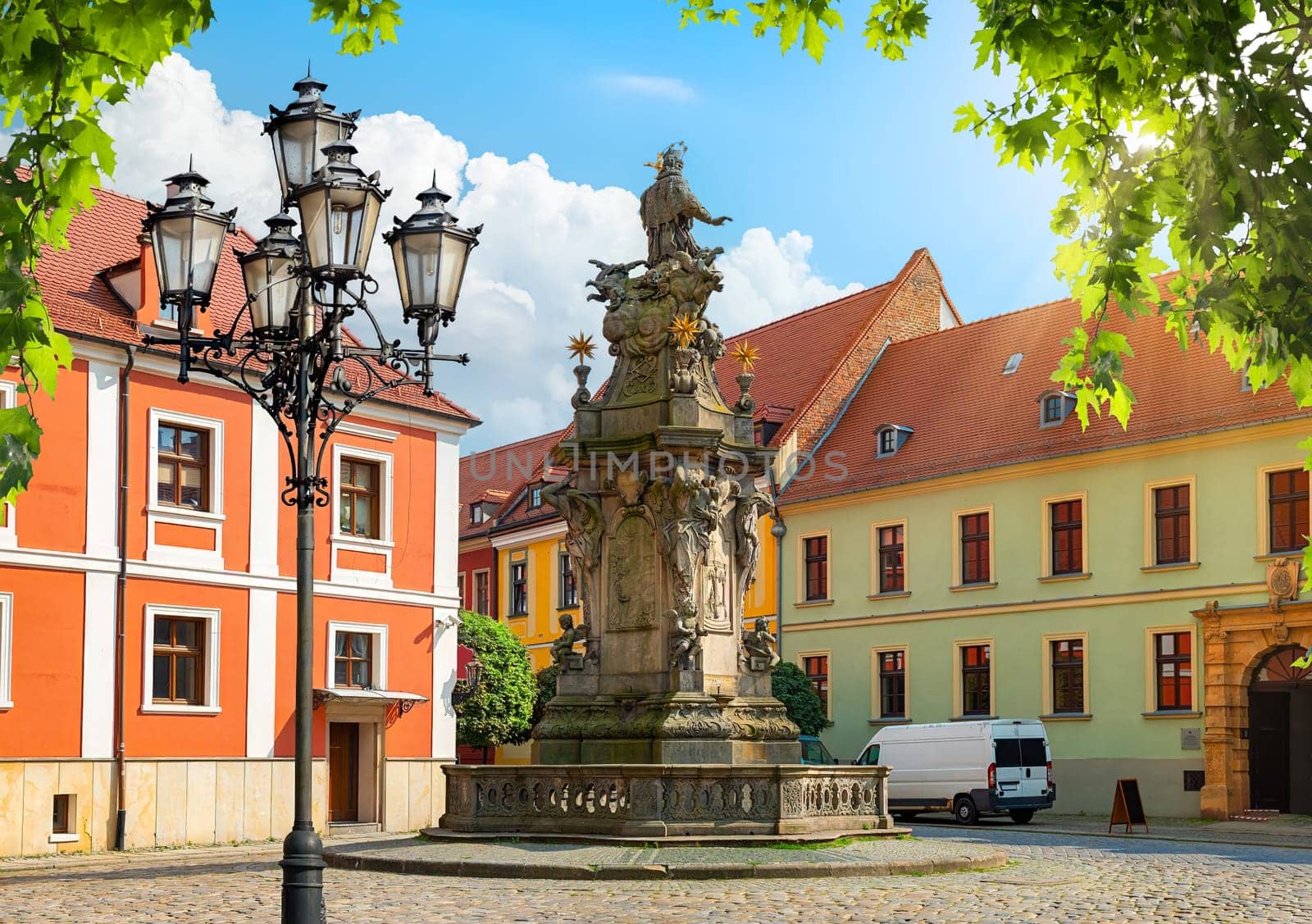 View on statue of John Nepomunk and Collegiate Church of the Holy Cross and Bartholomew