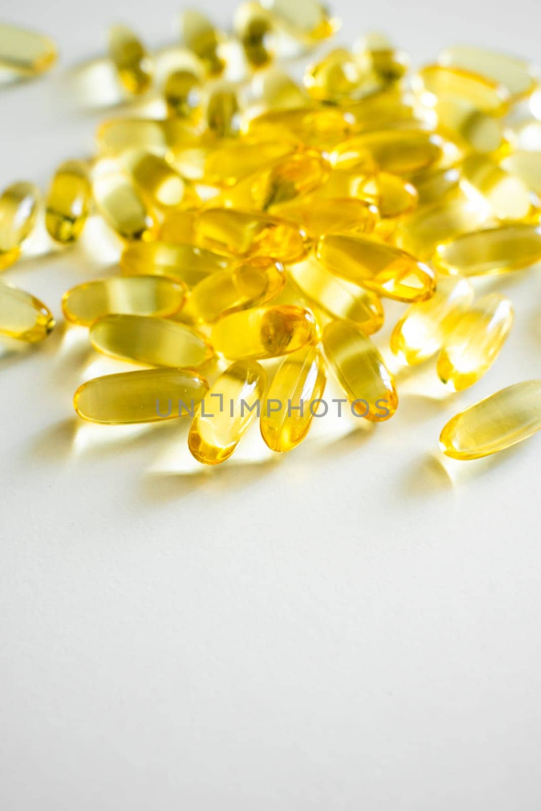 Close up cod liver oil omega 3 gel capsules. Fish oil capsules with omega 3 on white background