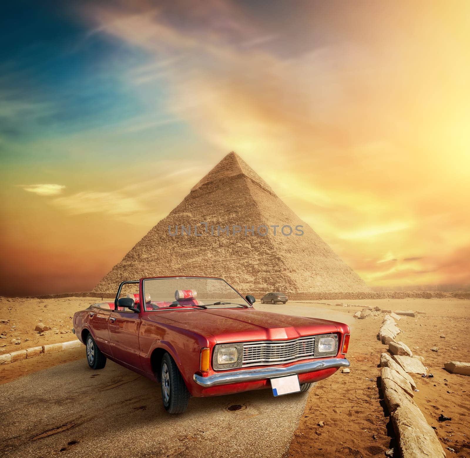 Car on the road near the Pyramid of Giza in Egypt