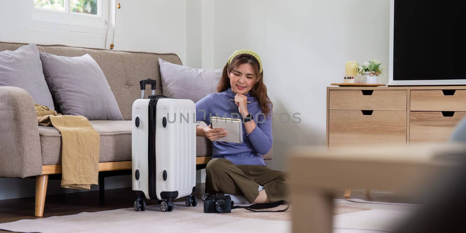Woman packing a suitcase for a new travel trip. bag and luggage for journey.