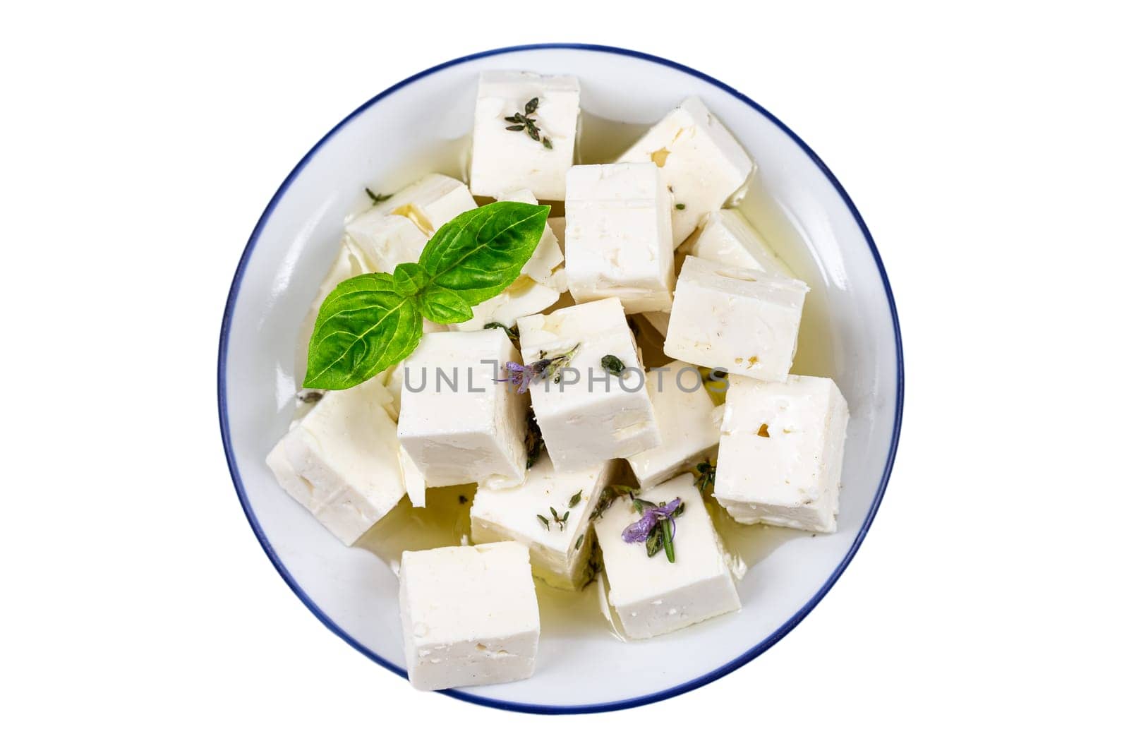 cbes of Feta cheese isolated on white background clipping Heap of Feta cheese, basil leaves and tomatoes. by JPC-PROD