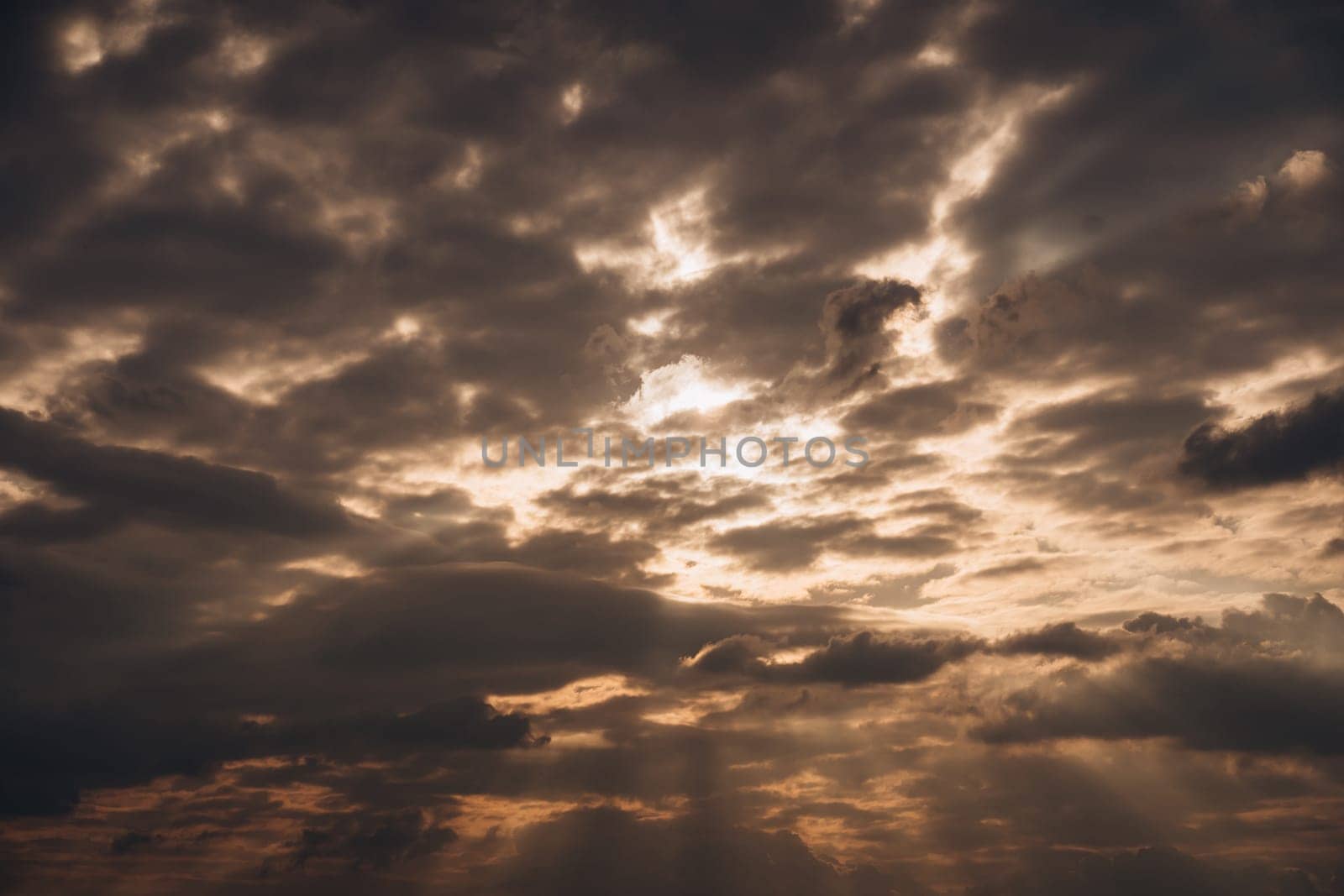 Sky with an incredible sunset and rays breaking through the clouds by Popov