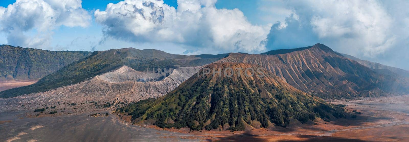 Superpano photo of Bromo volcano with cloudy blue sky by Popov