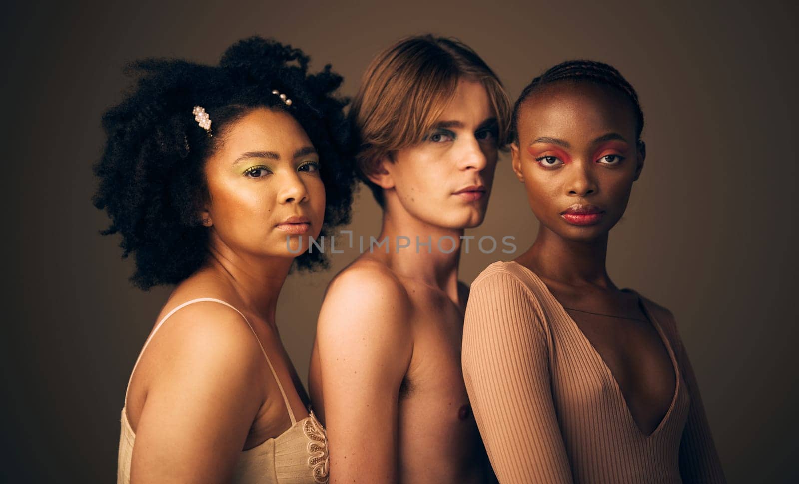 Portrait, beauty or skincare with a man and women in studio on a dark background for makeup or cosmetics. Face, friends and diversity with confident young people posing for inclusion or freedom.