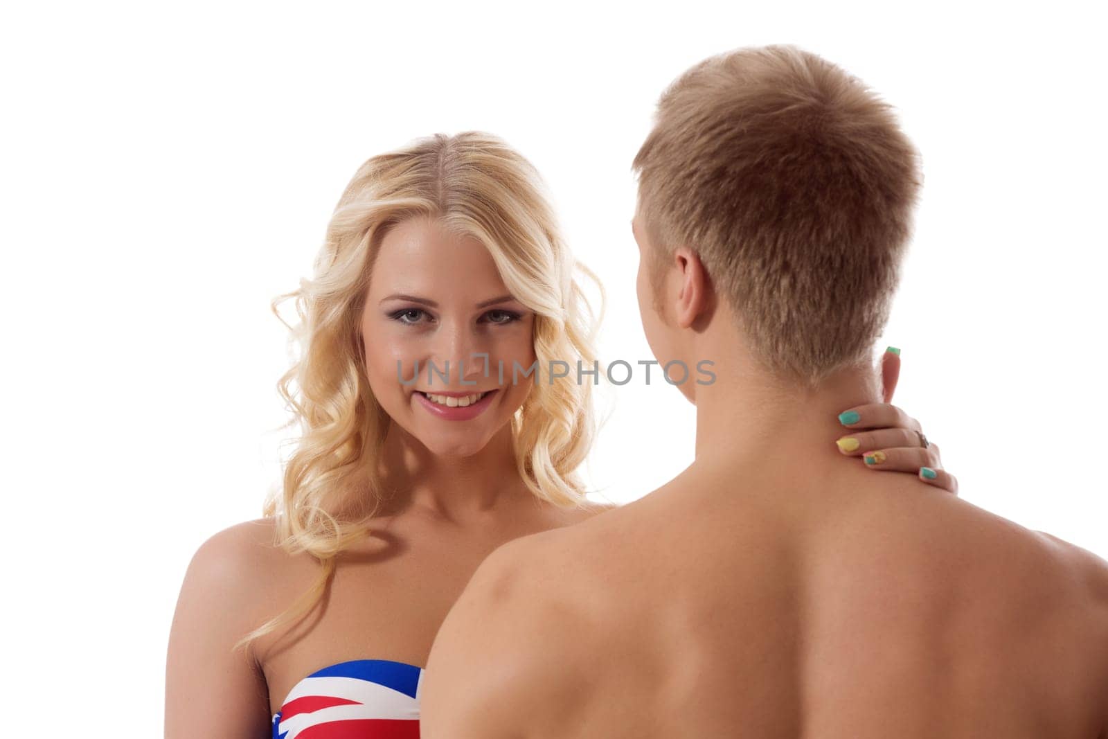Smiling blonde touching her boyfriend's neck, isolated on white