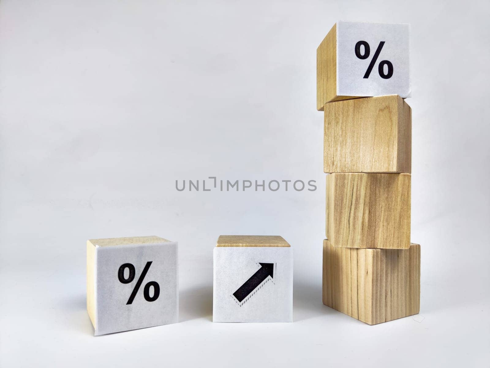 Wooden cubes with arrows and percentages on black background. Stages of action and goal achievement. Planning. Business actions. Receiving income and profit