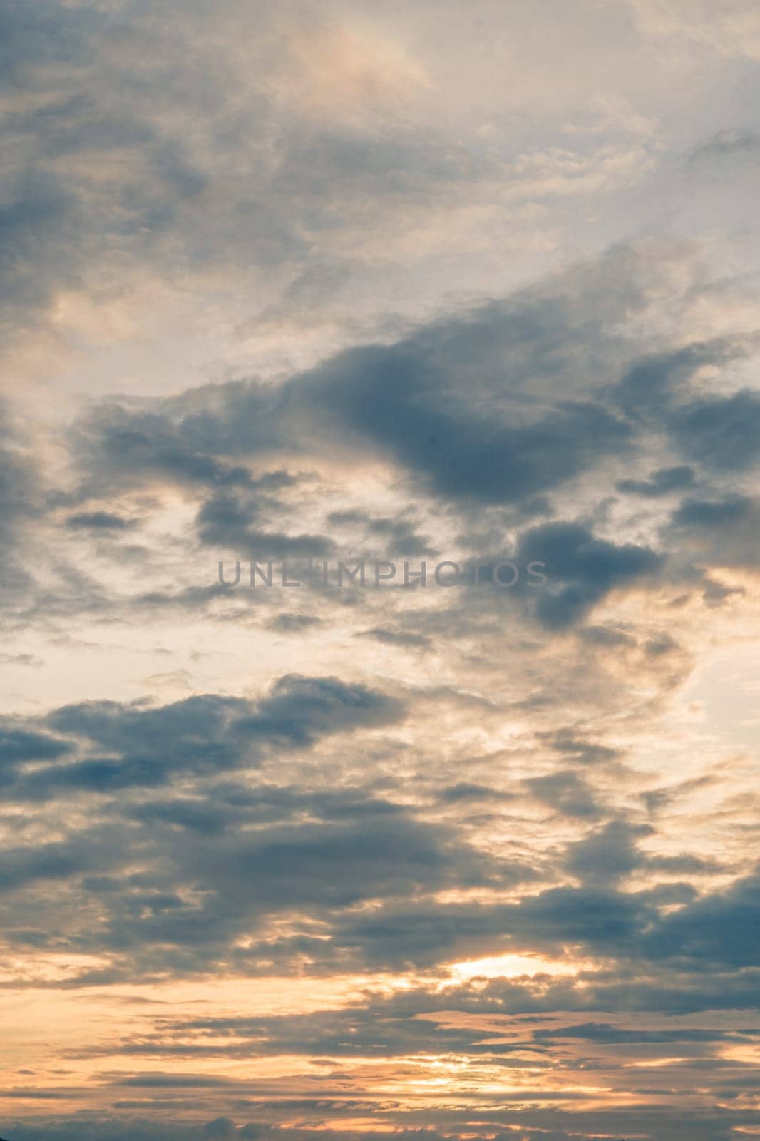 Abstract background sky Dawn Sunset Contrast dark shadow bright cloud sun orange silhouette above the mountains near the sea.