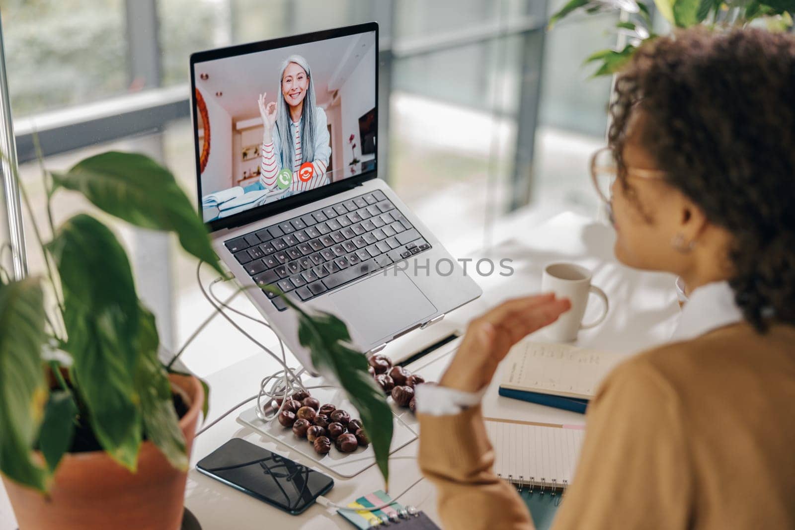 Stylish business woman have video conference with client while sitting in office