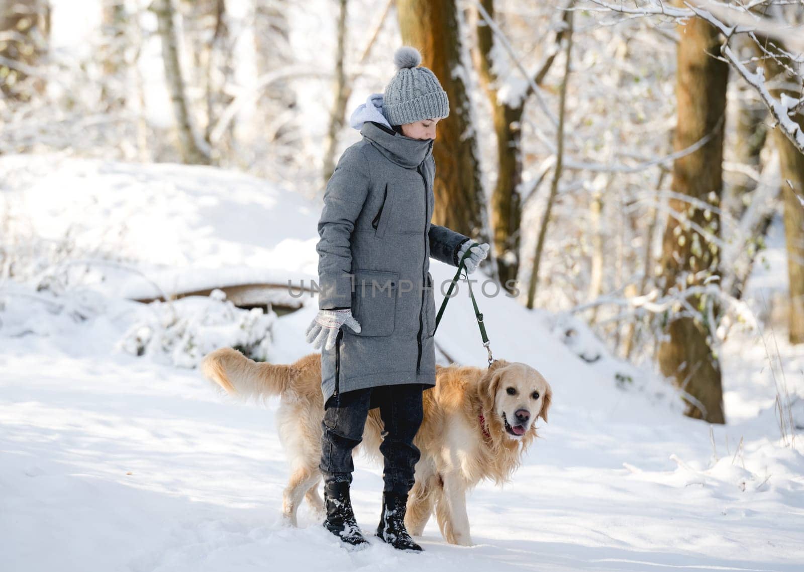 Teenage Girl With Golden Retriever In Winter Forest by tan4ikk1