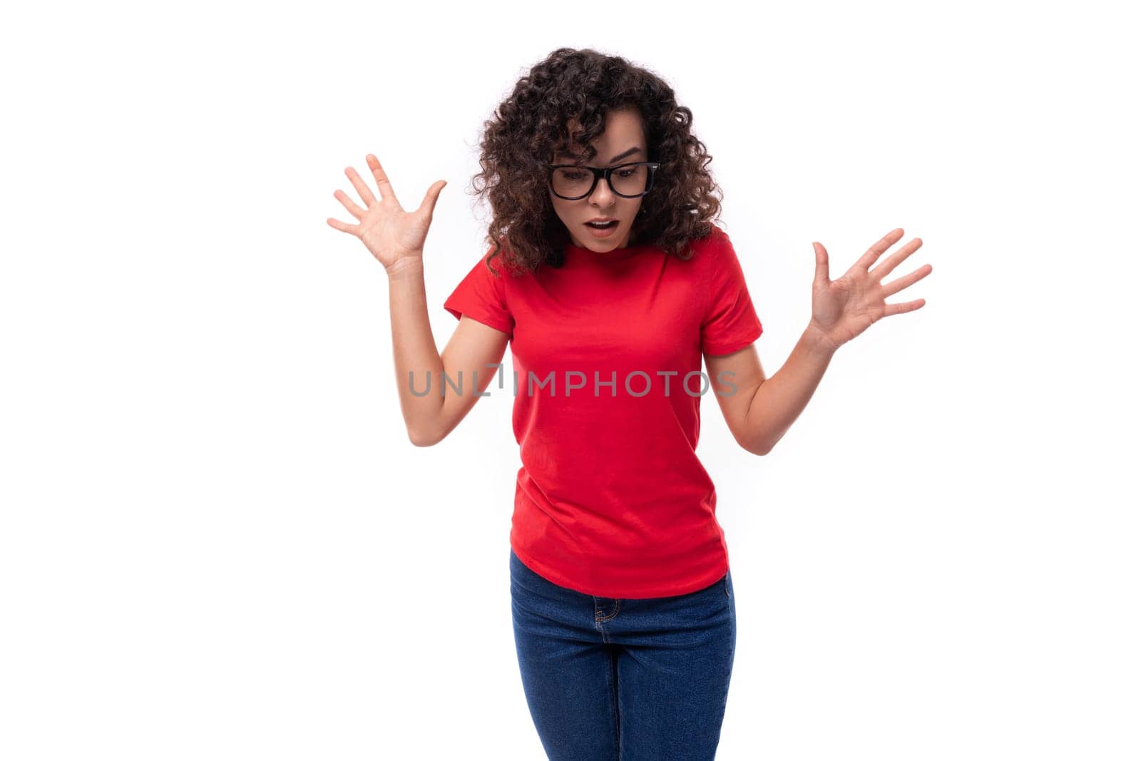 young promoter woman dressed in a red basic t-shirt with printable mockup isolated on white background with copy space.