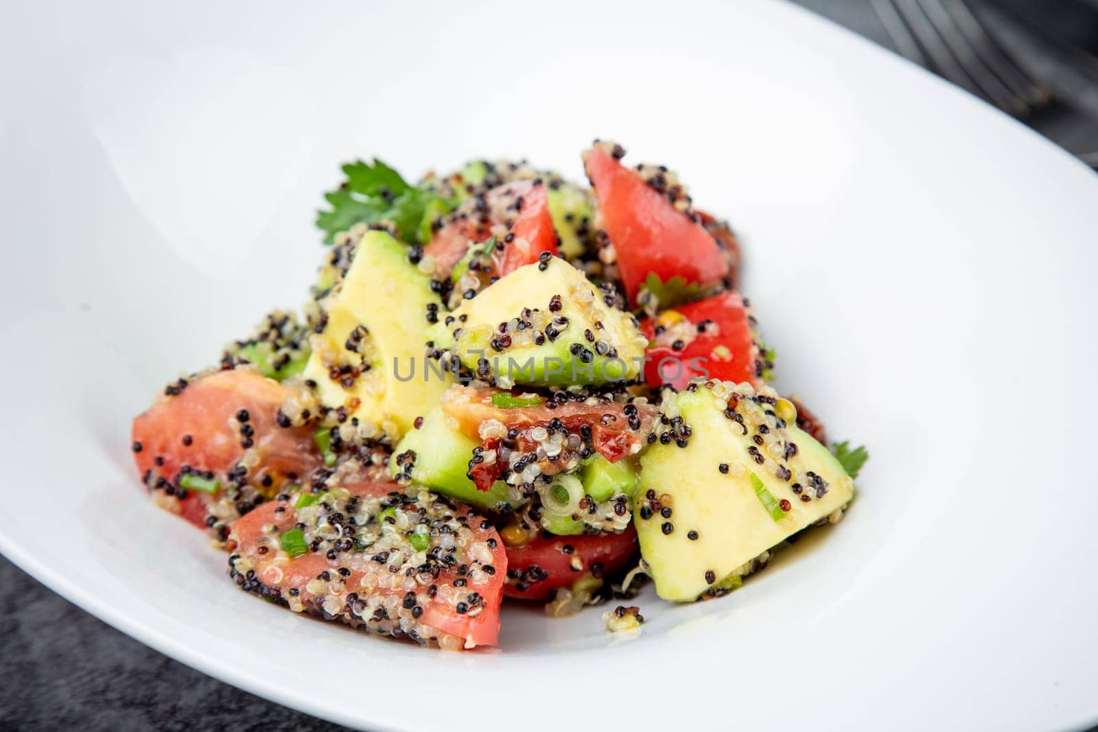 salad of tomatoes, zucchini, grated garlic with a lot of sesame seeds, top view by tewolf