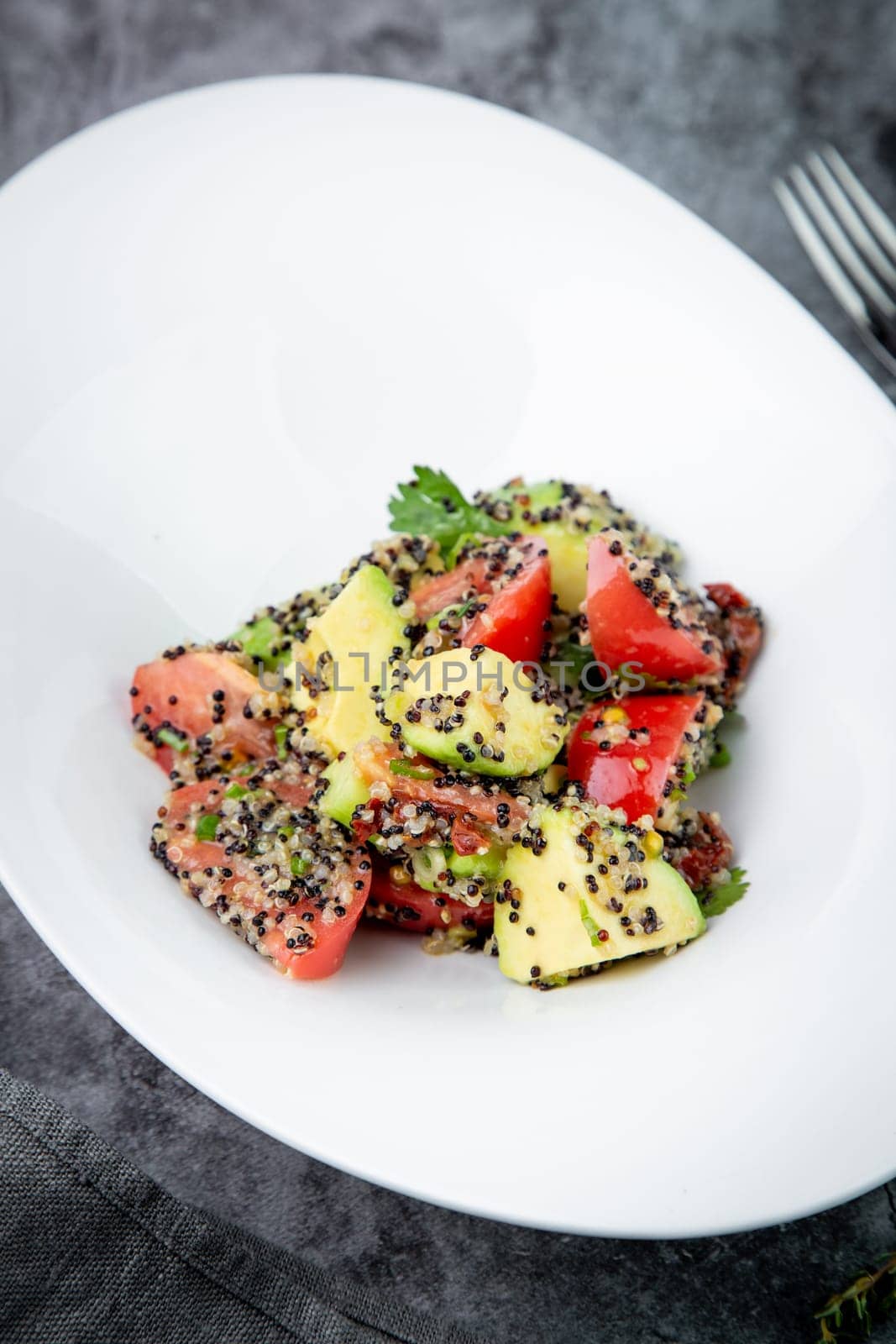 salad of tomatoes, zucchini, grated garlic with a lot of sesame seeds, top view by tewolf