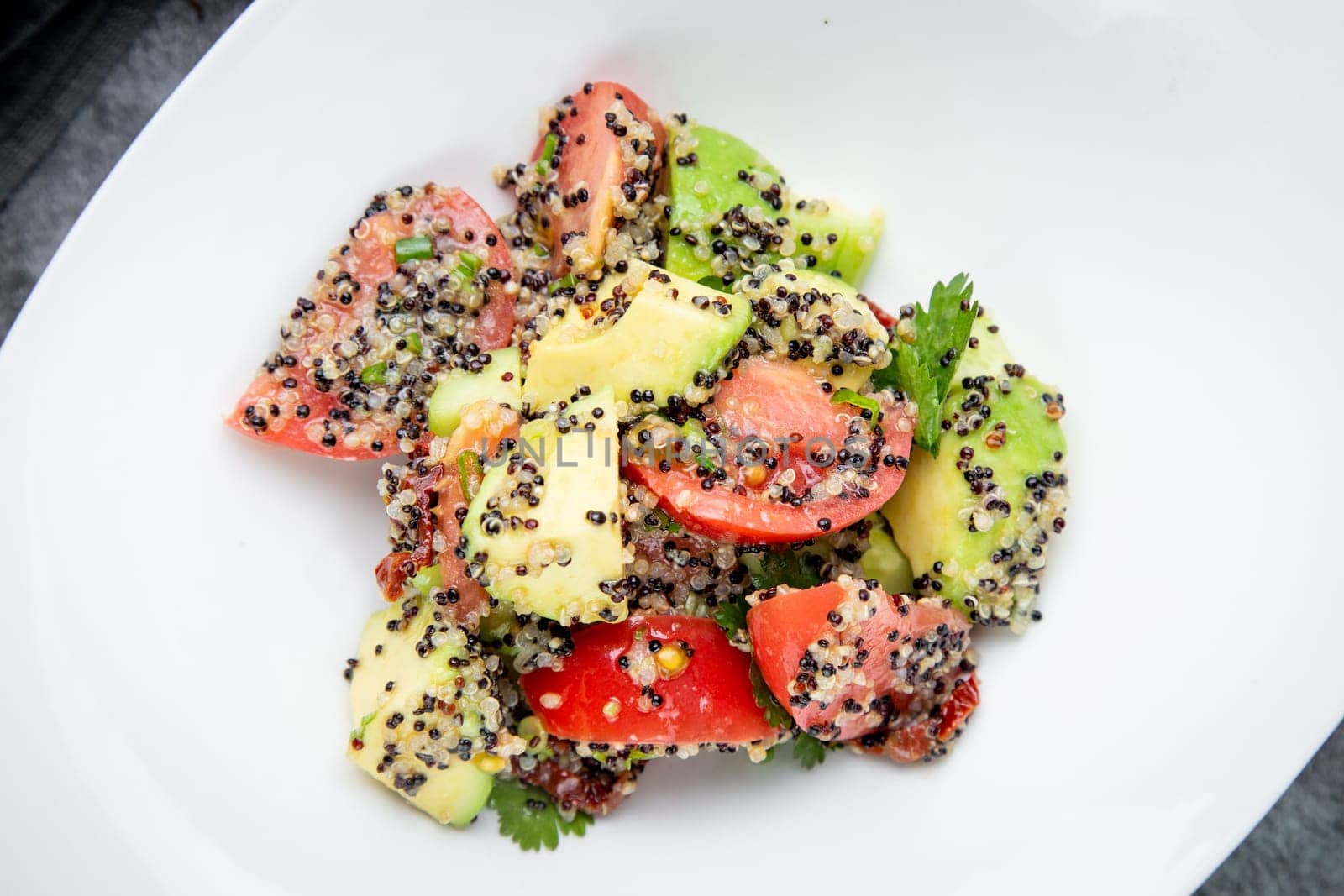 salad of tomatoes, zucchini, grated garlic with a lot of sesame seeds, top view by tewolf