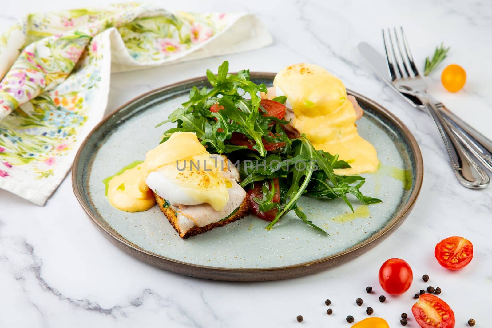 breakfast of arugula and tomato, toast with cheese and poached egg