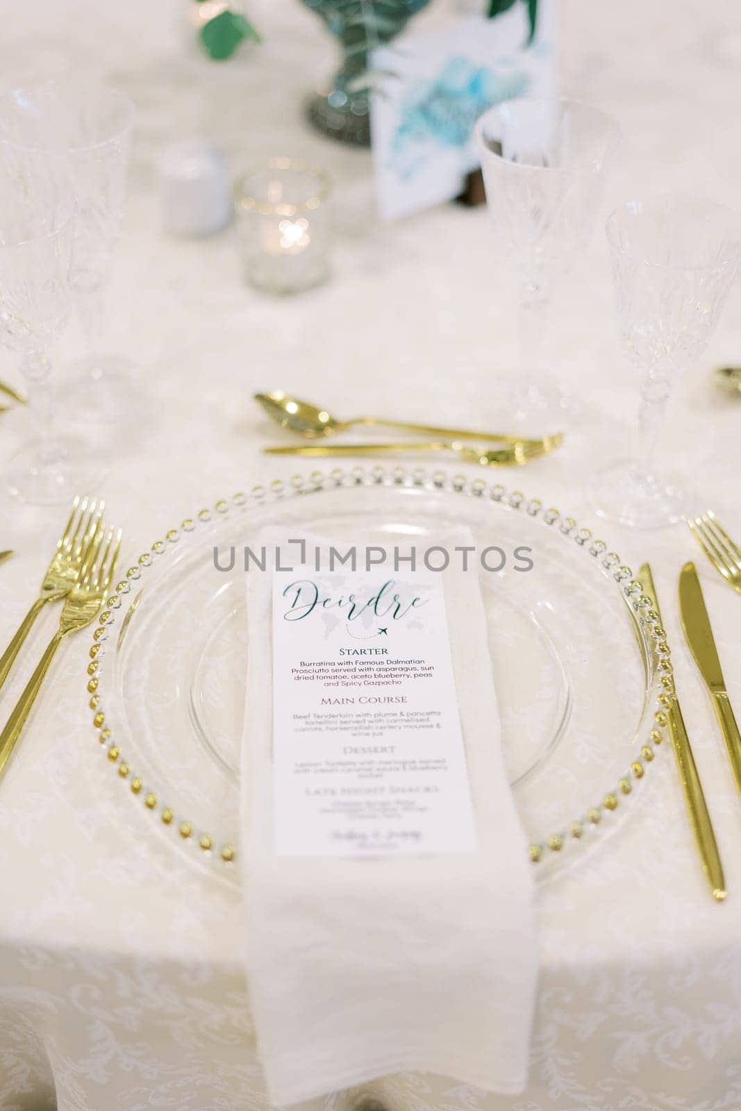 Banquet menu lies on a plate on a set festive table. High quality photo
