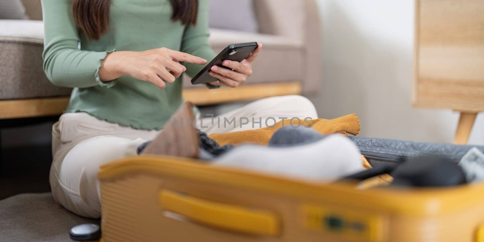 Traveler woman packing prepare stuff and outfit clothes in suitcases travel bag luggage for holiday at home, weekend, tourist, journey.