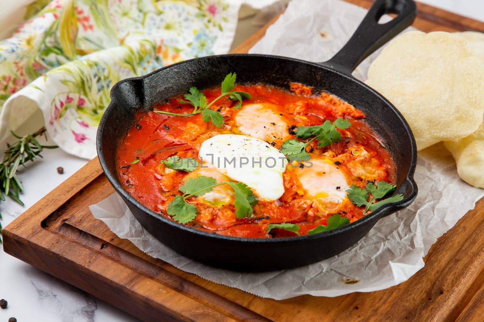 beetroot borscht with sour cream and parsley in a frying pan