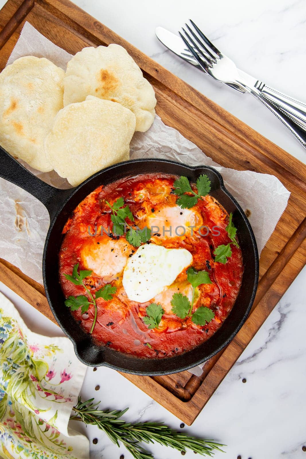 beetroot borscht with sour cream and parsley in a frying pan