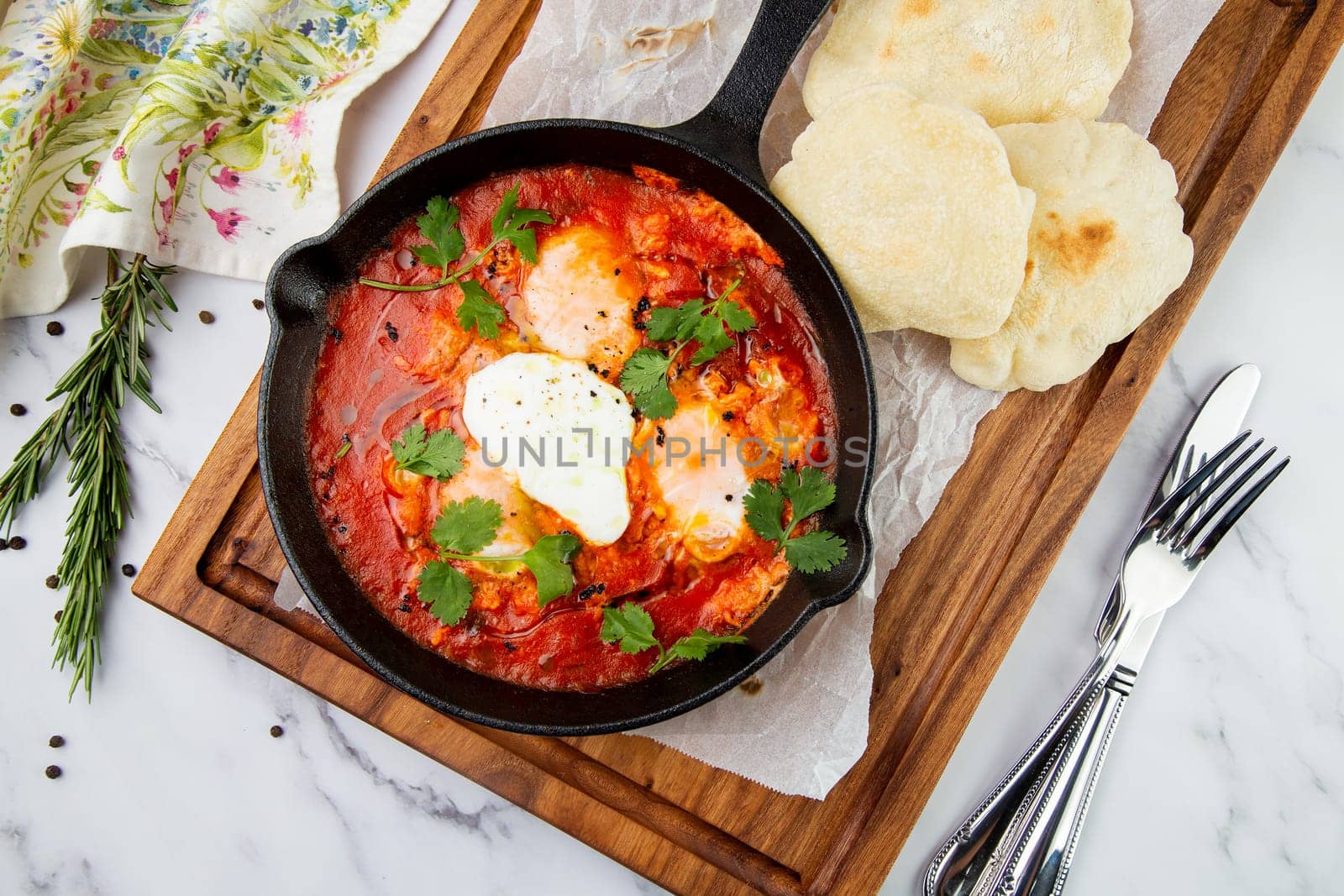 beetroot borscht with sour cream and parsley in a frying pan