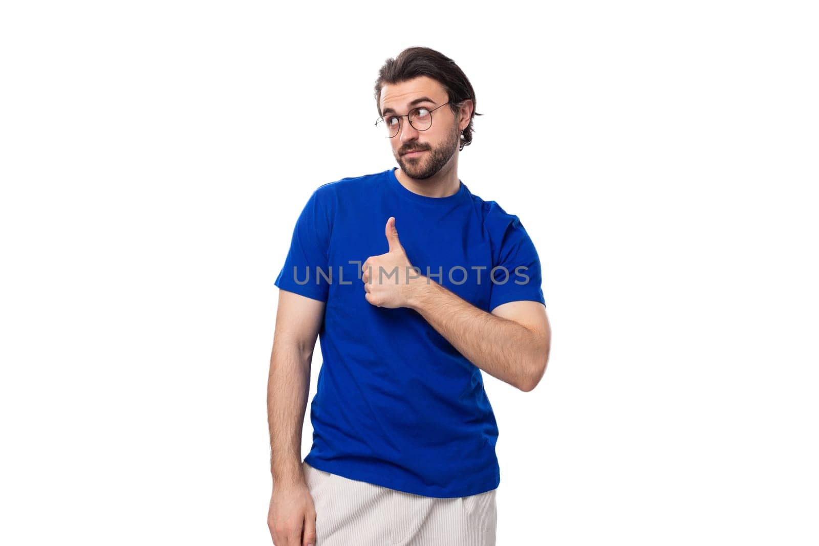young smart brunette european man with beard in casual blue t-shirt.