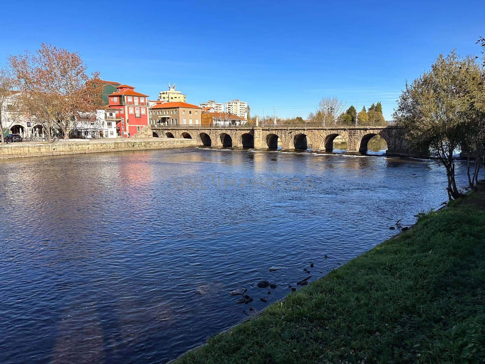 Hiker's point of view along the Tamega river city park in Chaves, Portugal.