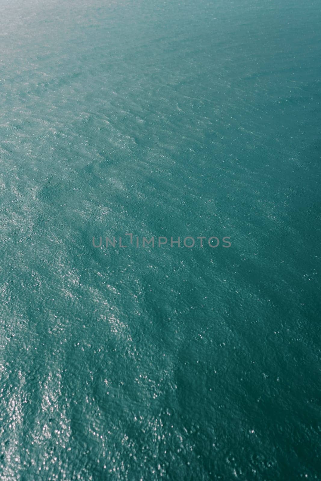 Blue sea sparkling in the sun. Top view. High quality photo