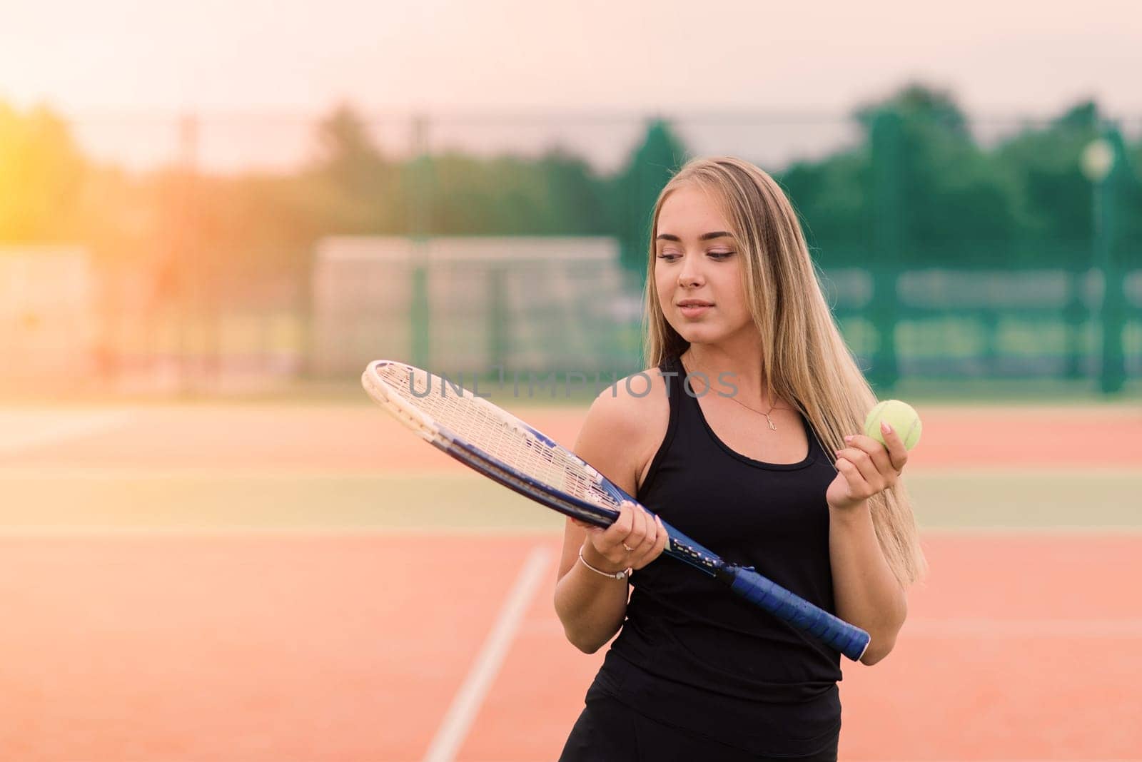 Tennis tournament. Female player at clay tennis court