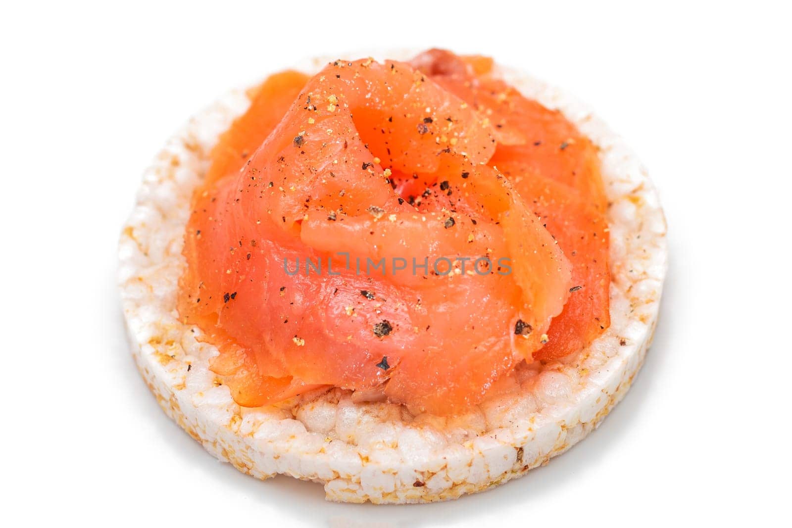 Tasty Rice Cake Sandwich with Fresh Salmon Slices Isolated on White. Easy Breakfast and Diet Food. Crispbread with Red Fish. Healthy Dietary Snack - Isolation
