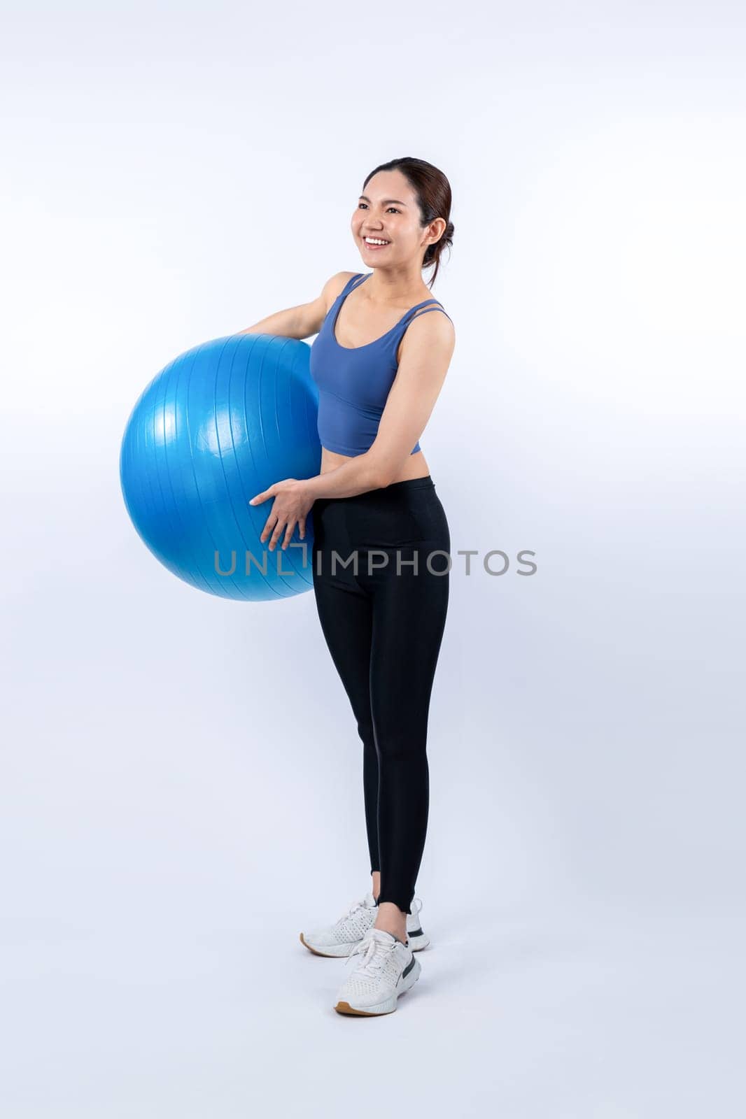 Young attractive asian woman portrait in sportswear with fit ball. Vigorous by biancoblue