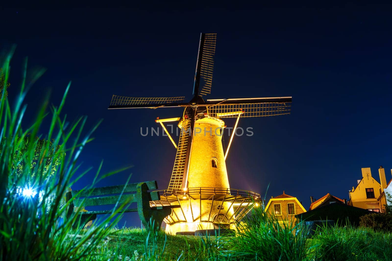 Old Windmill Illuminated by Lights at Night in Zierikzee, Netherlands by PhotoTime