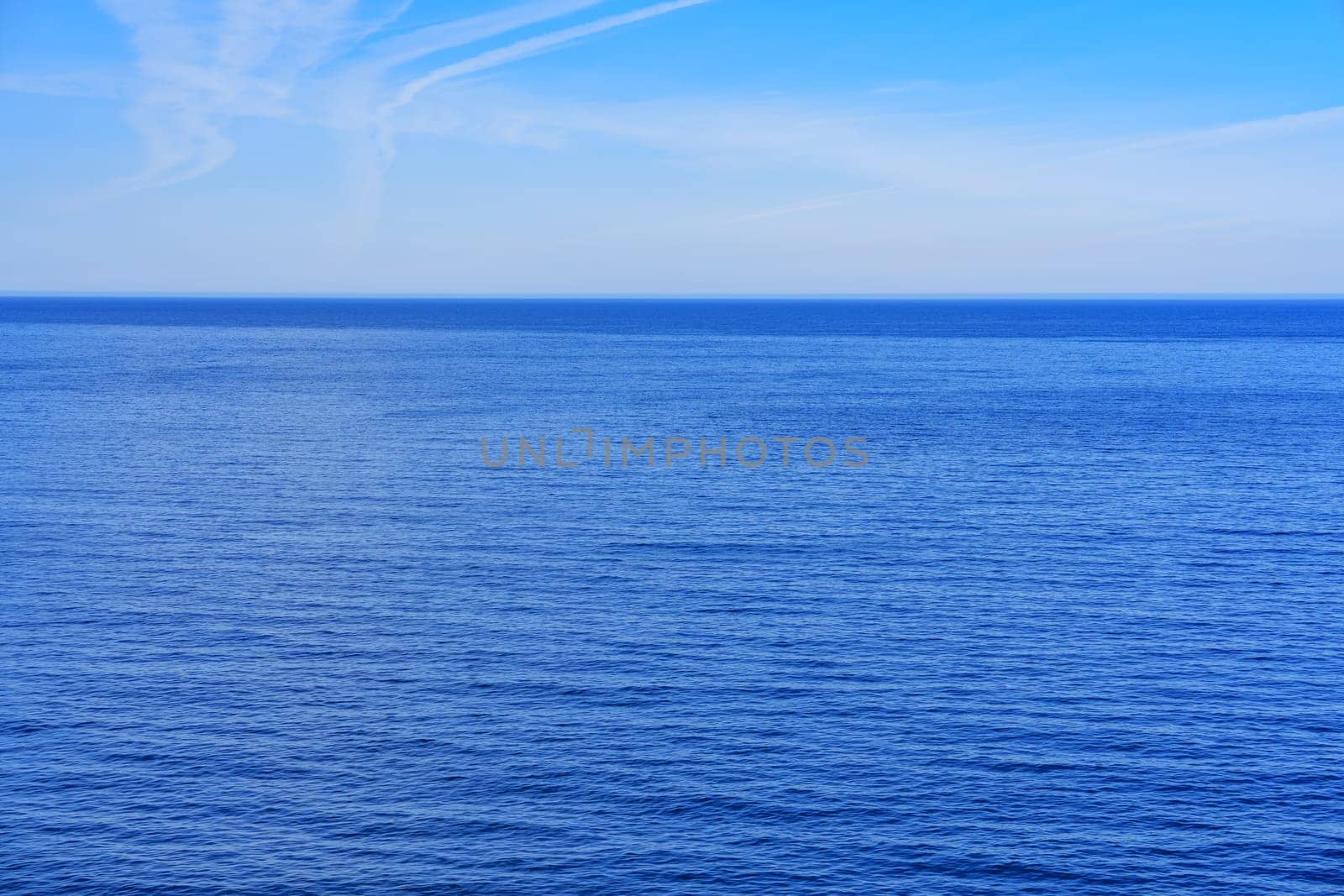 Serenity of Blue Ocean Meeting Endless Sky, Ideal for Promotional Purposes and Product Advertisement by PhotoTime