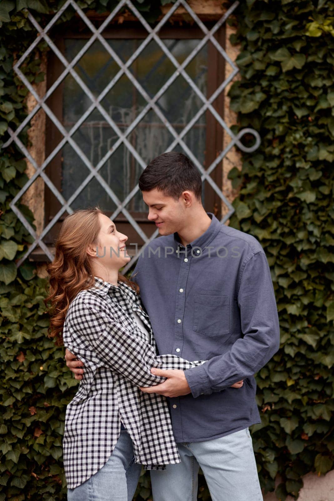 Young Cute Female Hugs Boyfriend. In Autumn Outdoor. Lovers Walking in Park. Attractive Funny Couple. Lovestory in Forest. Man and Woman. Cute Lovers in the Park. Family Concept. Happy Couple.