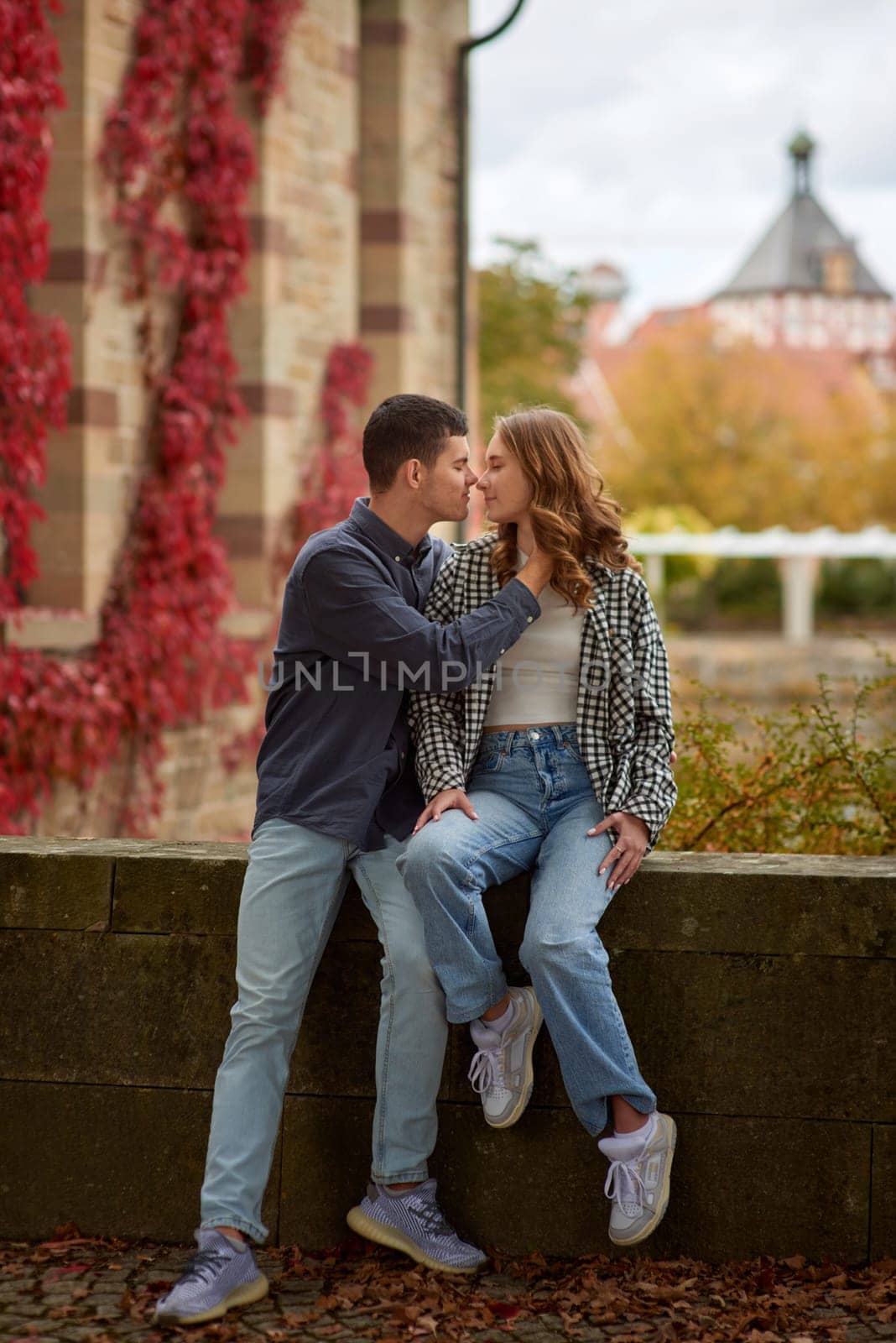 Young Cute Female Hugs Boyfriend. In Autumn Outdoor. Lovers Walking in Park. Attractive Funny Couple. Lovestory in Forest. Man and Woman. Cute Lovers in the Park. Family Concept. Happy Couple. by Andrii_Ko