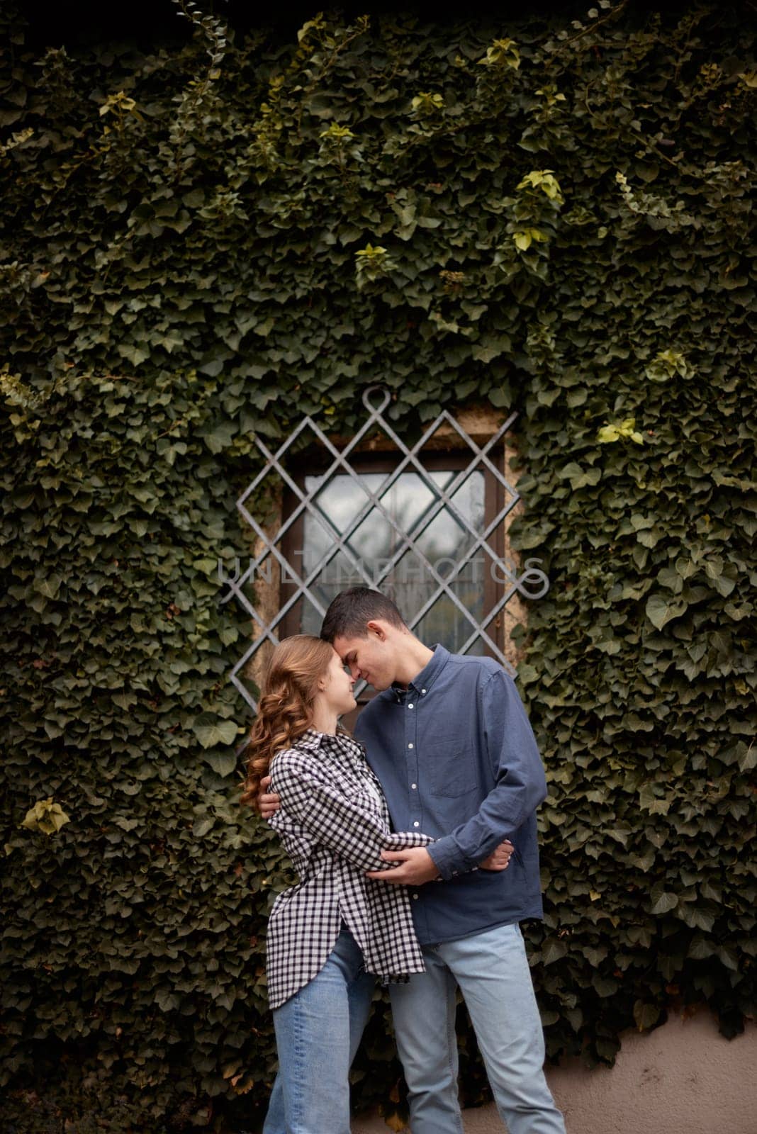 Young Cute Female Hugs Boyfriend. In Autumn Outdoor. Lovers Walking in Park. Attractive Funny Couple. Lovestory in Forest. Man and Woman. Cute Lovers in the Park. Family Concept. Happy Couple.