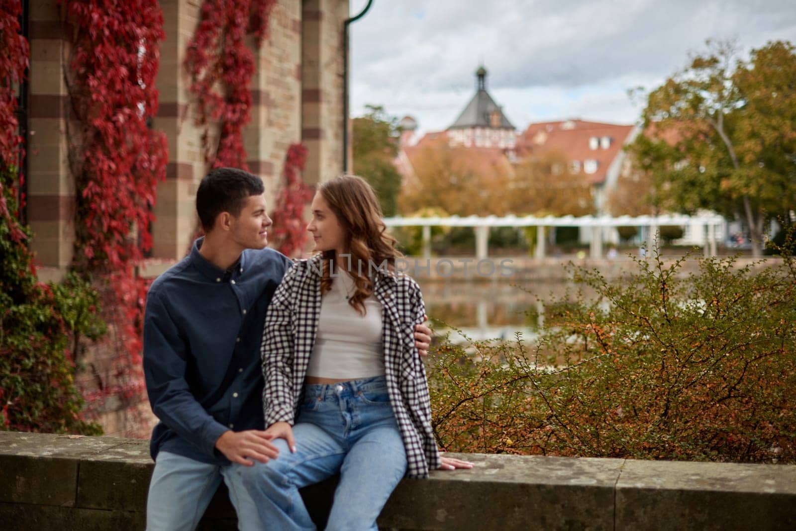 Young Cute Female Hugs Boyfriend. In Autumn Outdoor. Lovers Walking in Park. Attractive Funny Couple. Lovestory in Forest. Man and Woman. Cute Lovers in the Park. Family Concept. Happy Couple.