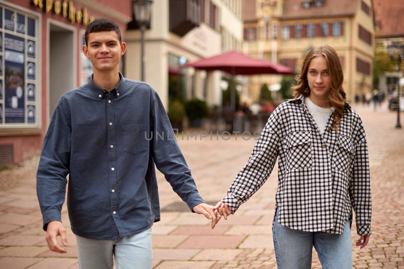 Young Cute Female Hugs Boyfriend. In Autumn Outdoor. Lovers Walking in Park. Attractive Funny Couple. Lovestory in Forest. Man and Woman. Cute Lovers in the Park. Family Concept. Happy Couple. by Andrii_Ko