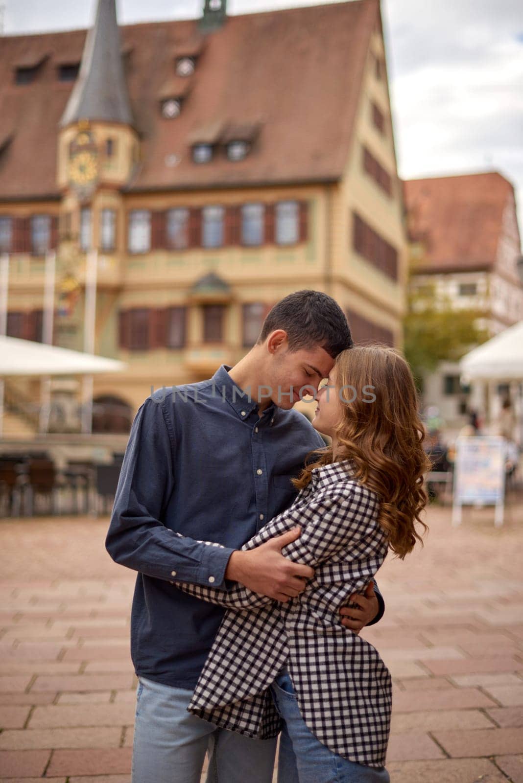 Young Cute Female Hugs Boyfriend. In Autumn Outdoor. Lovers Walking in Park. Attractive Funny Couple. Lovestory in Forest. Man and Woman. Cute Lovers in the Park. Family Concept. Happy Couple.