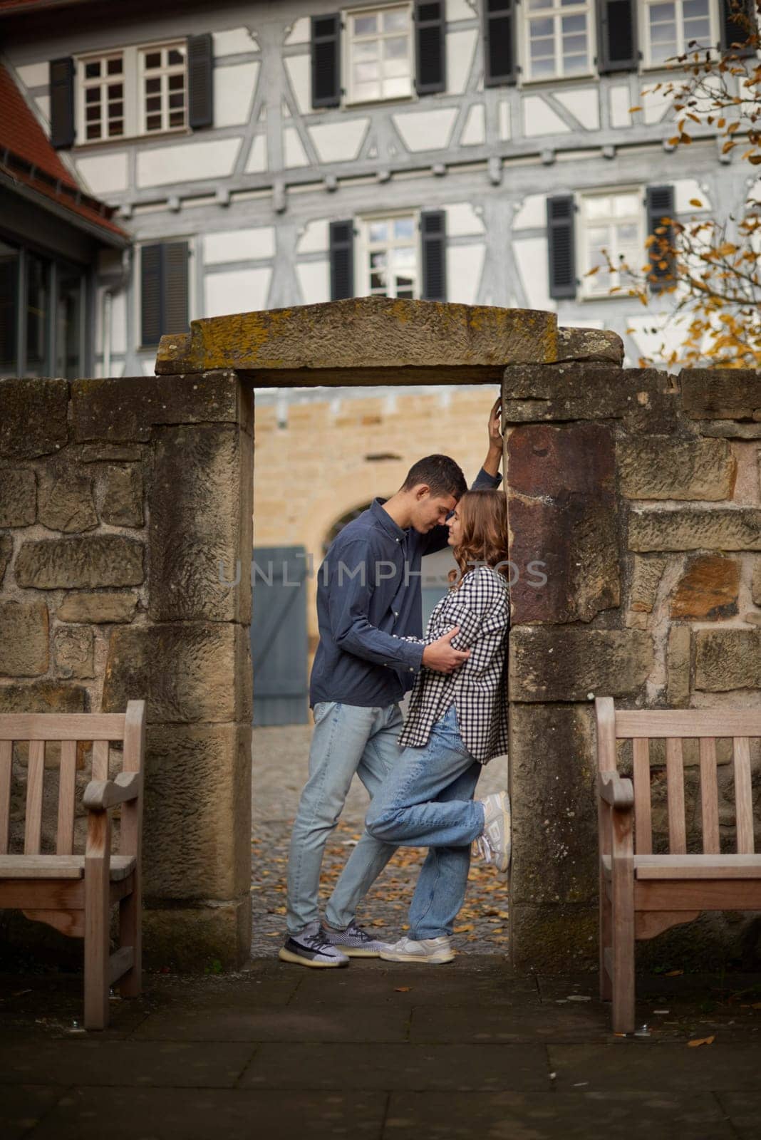 Young Cute Female Hugs Boyfriend. In Autumn Outdoor. Lovers Walking in Park. Attractive Funny Couple. Lovestory in Forest. Man and Woman. Cute Lovers in the Park. Family Concept. Happy Couple. by Andrii_Ko