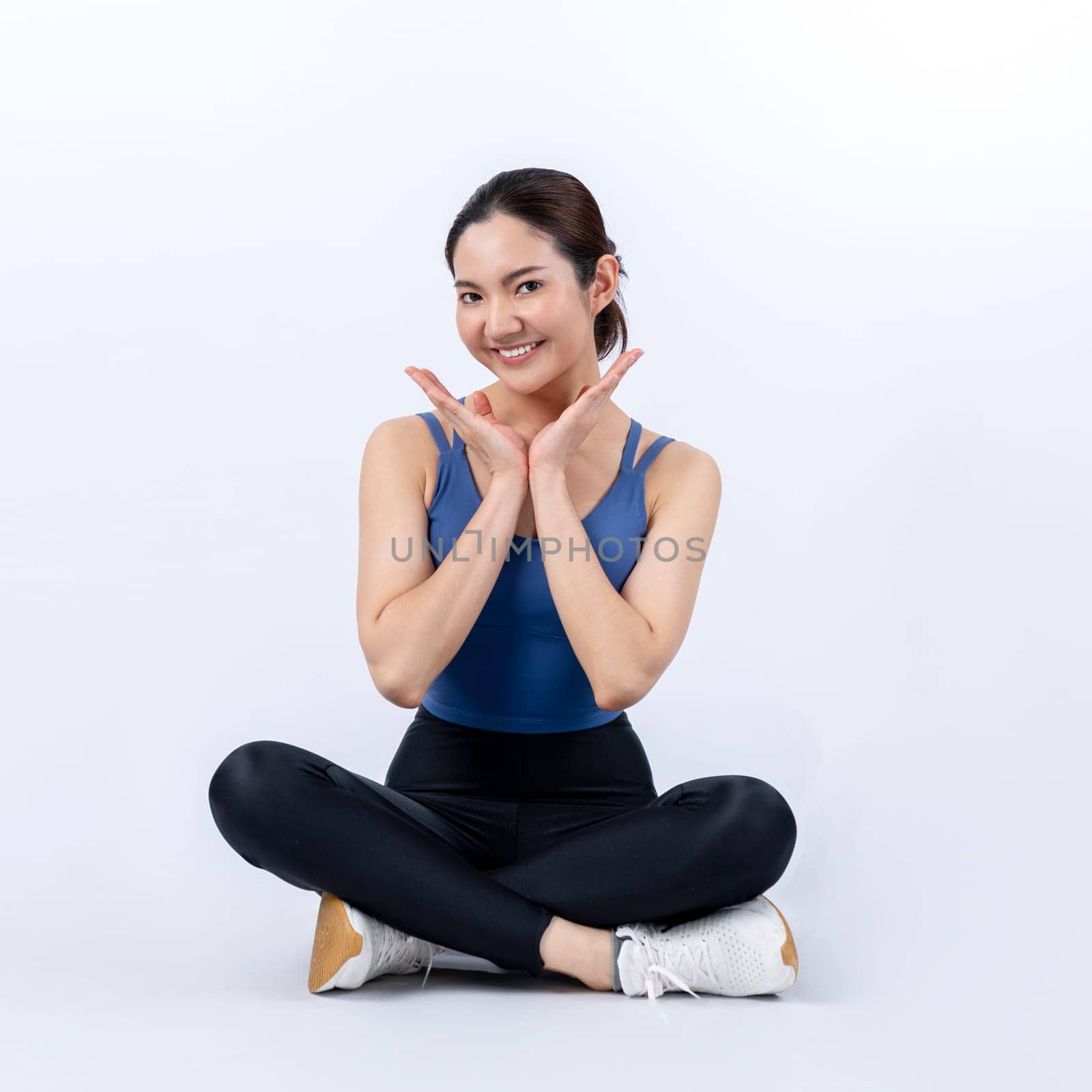 Full body asian woman in sportswear portrait, smiling and posing cheerful gesture. Workout training with attractive girl engage in her pursuit of healthy lifestyle. Isolated background Vigorous