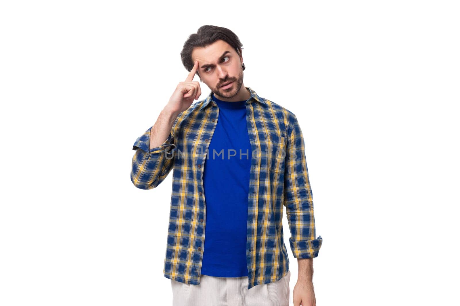 handsome energetic positive young European brunette man with a well-groomed beard and mustache dressed casually by TRMK