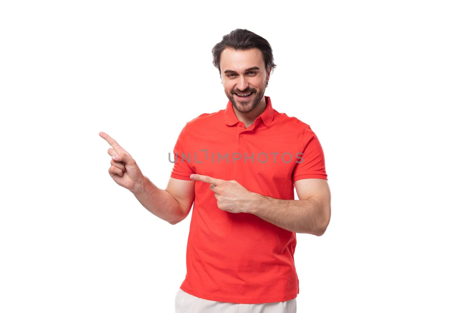 young brutal caucasian brunette man with beard wearing t-shirt is thinking about business strategy on studio background with copy space.
