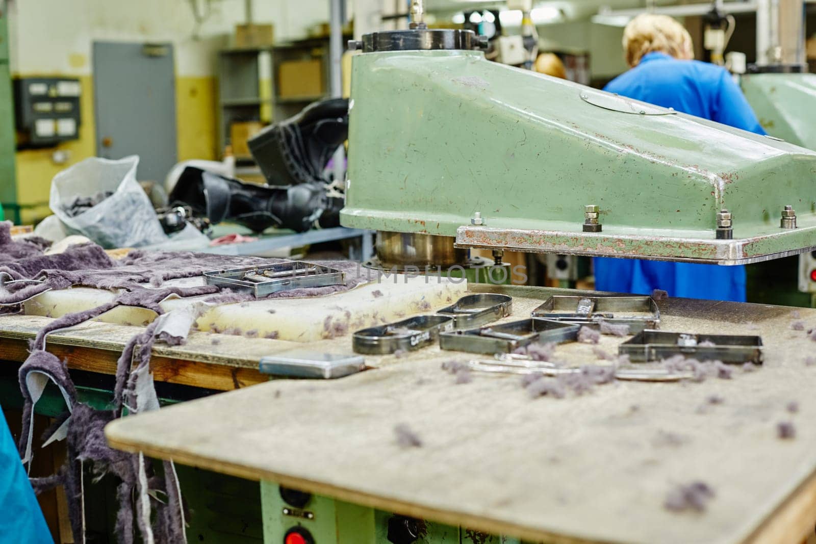 Manufacture of footwear. Cutting fur details, close-up