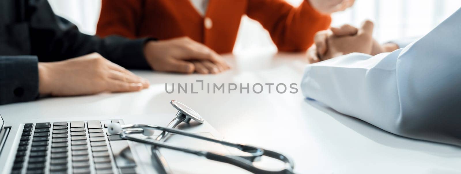 Couple attend fertility or medical consultation with gynecologist at hospital as family planning care for pregnancy. Husband and wife consoling each other through doctor appointment. Panorama Rigid