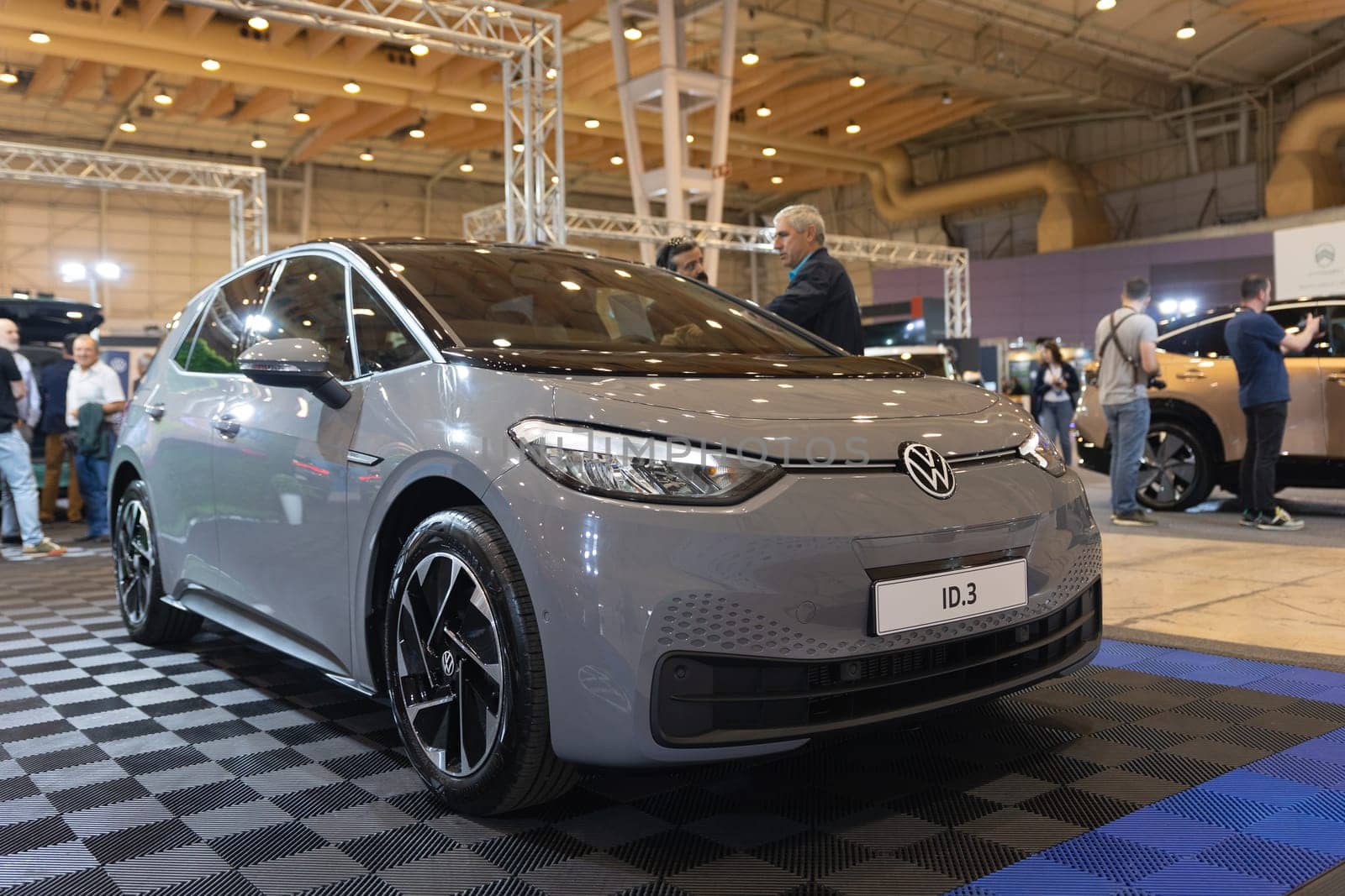 12 MAY 2023, Lisbon, Porugal, Electric car Show in International Fairy of Lisbon - A gray car is on display at a car show