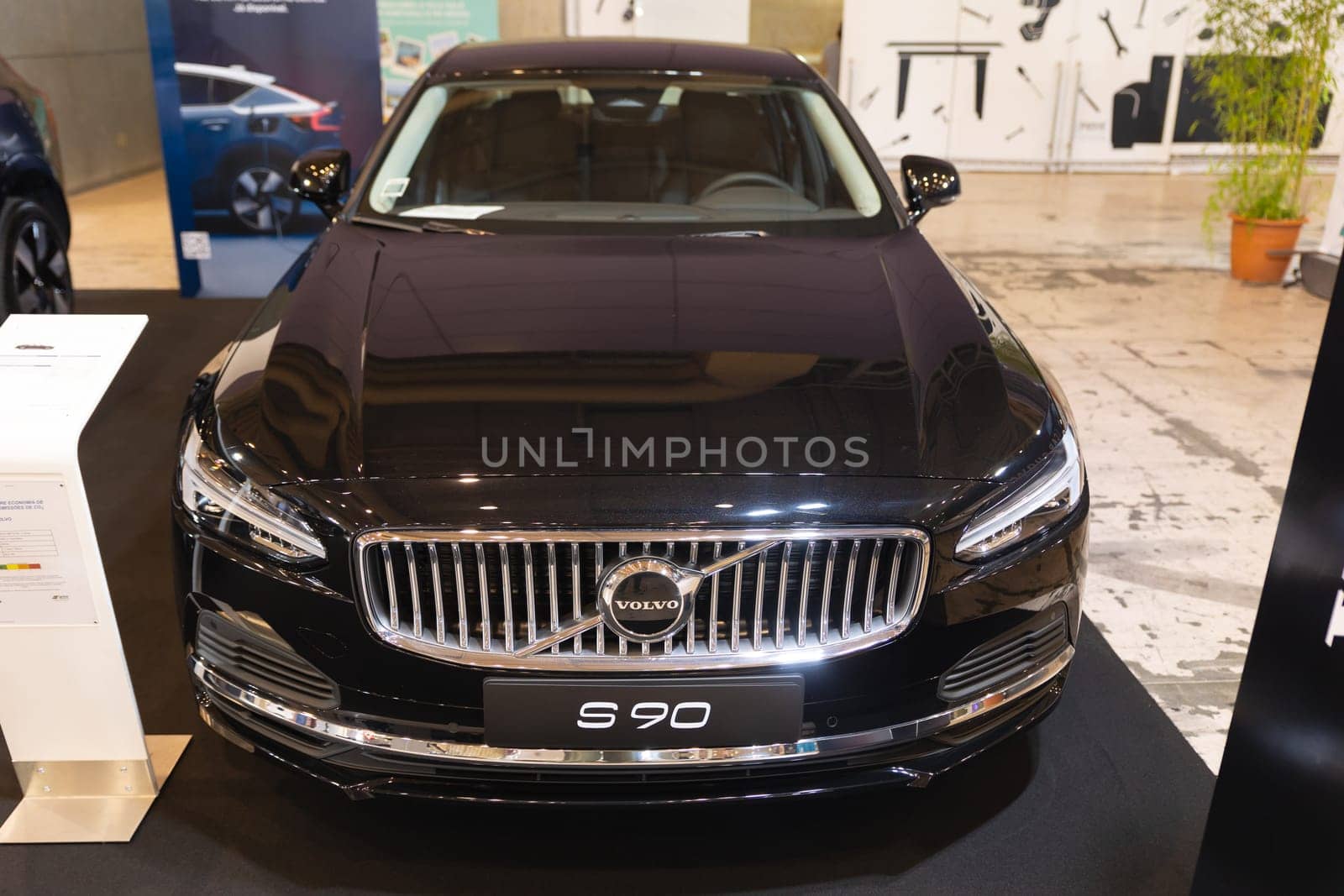 12 MAY 2023, Lisbon, Porugal, Electric car Show in International Fairy of Lisbon - black car is on display in a showroom