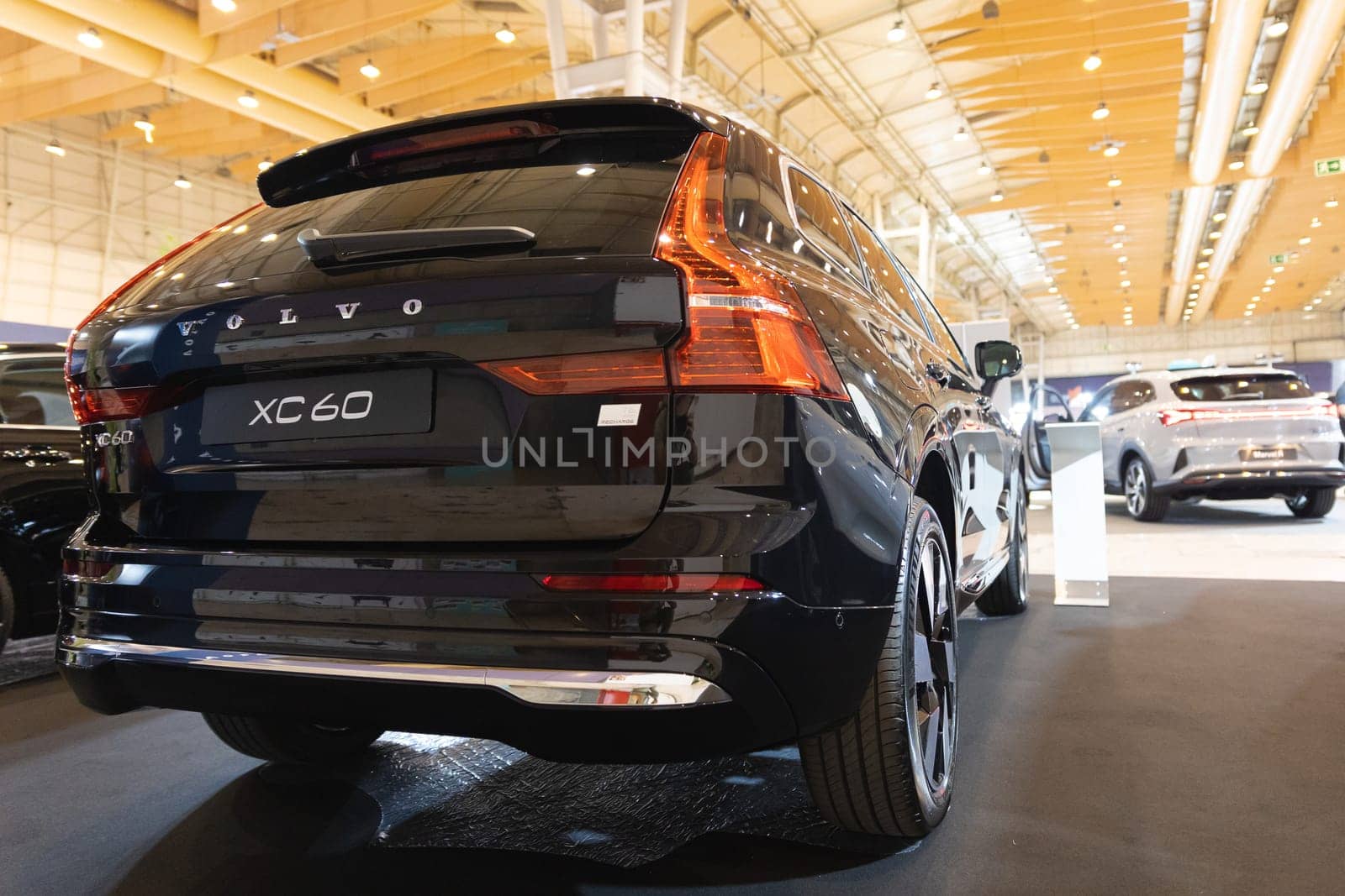 12 MAY 2023, Lisbon, Porugal, Electric car Show in International Fairy of Lisbon - A black volvo car is on display in a showroom