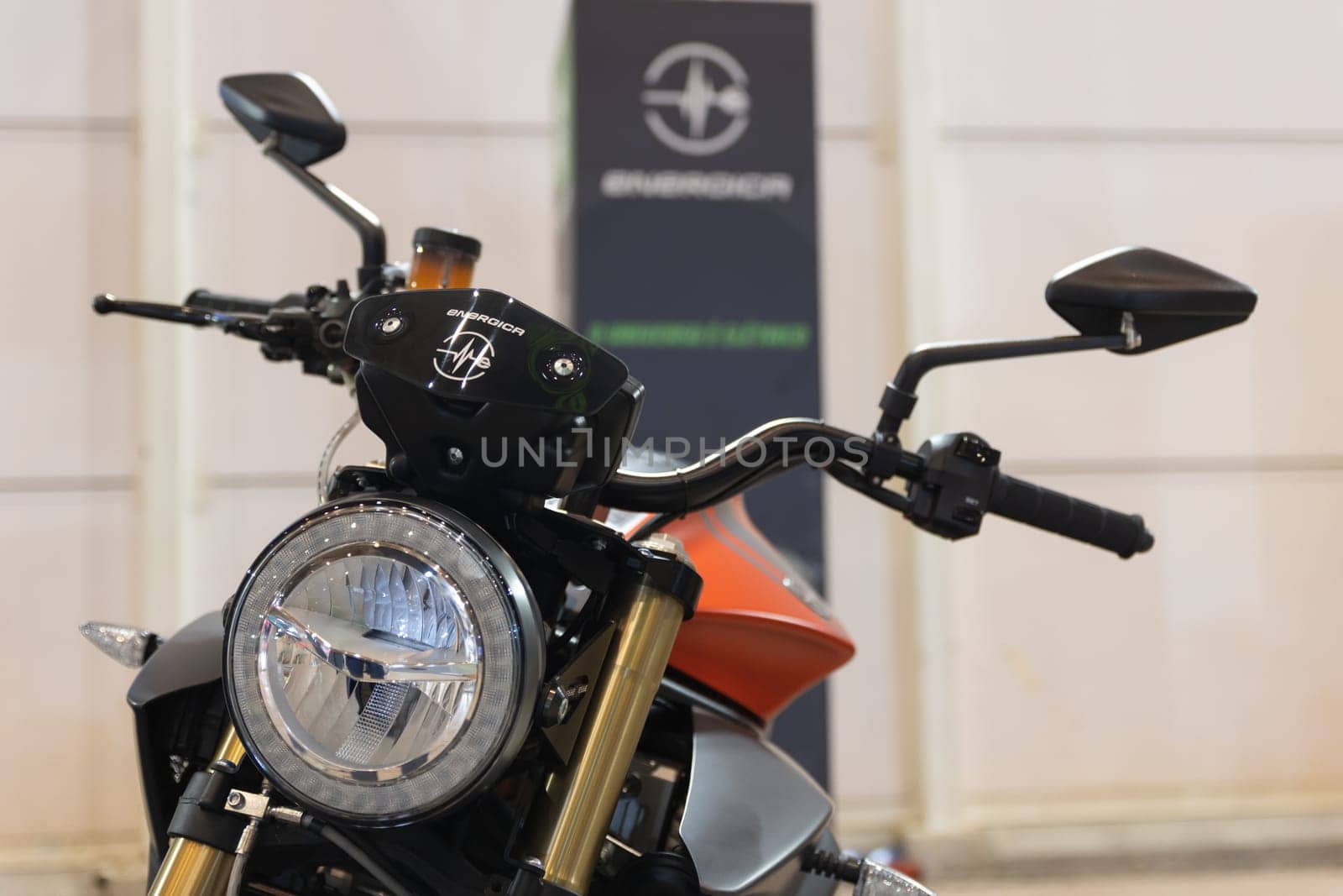 12 MAY 2023, Lisbon, Porugal, Electric car Show in International Fairy of Lisbon - A close up of a motorcycle parked in front of a building