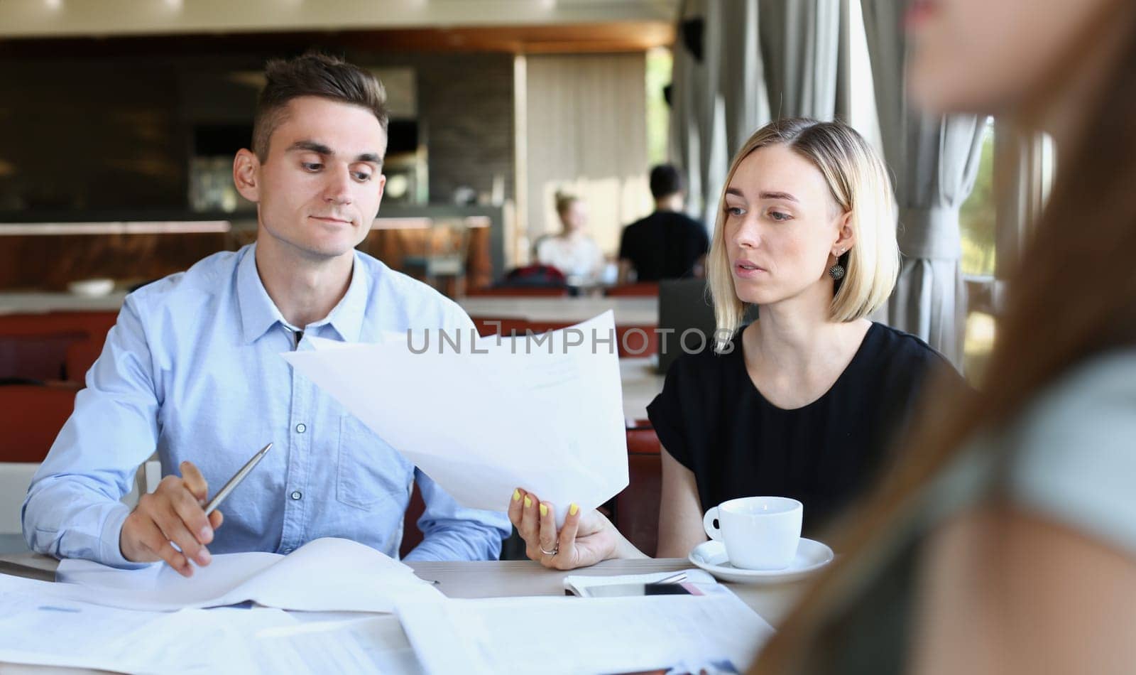 businessmen stady documents in cafe by kuprevich