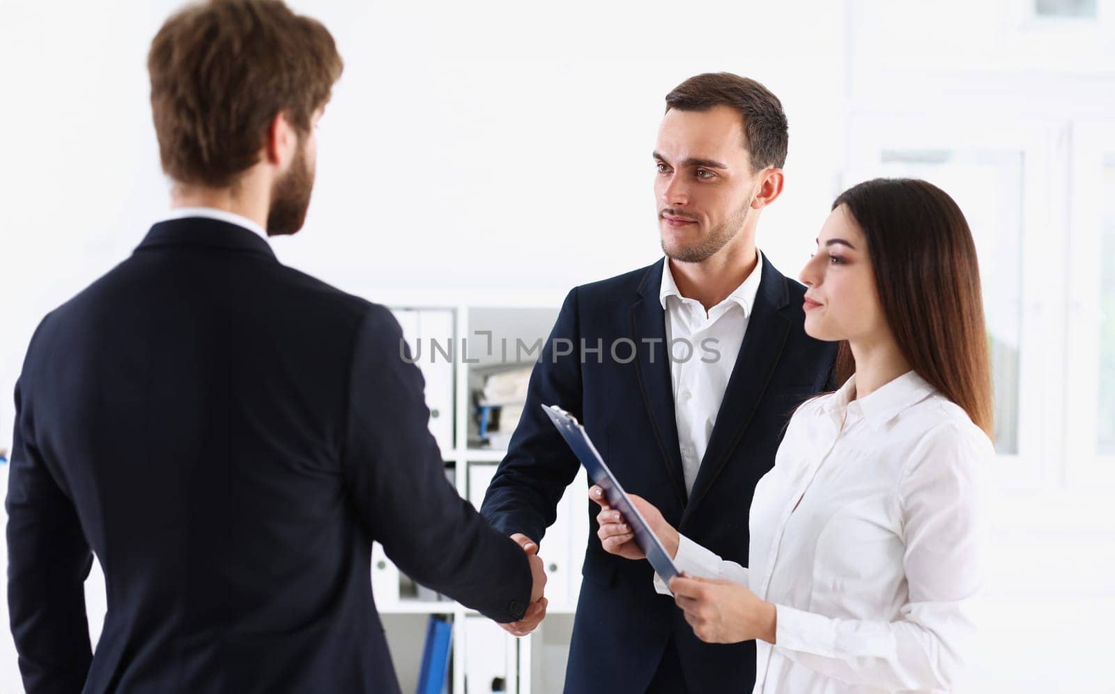 Escort service interpreter works with the transaction accompanies documents conclusion of the contract important situation. Arab businessman and his translator welcome business partner and says hello