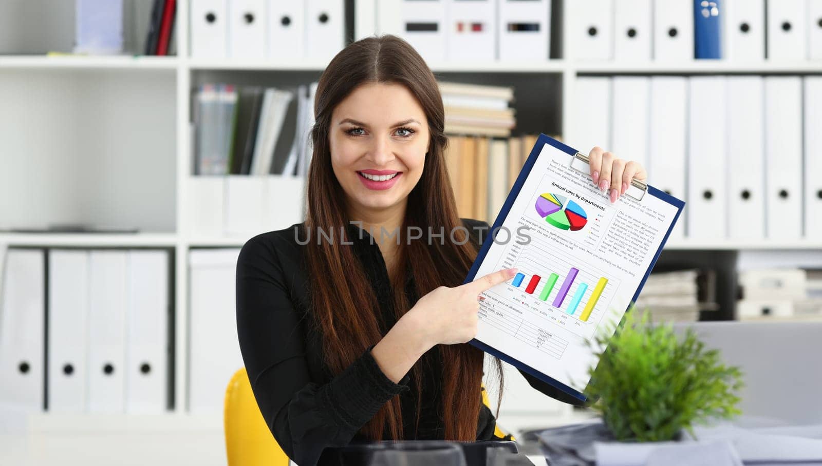 Female arm show stats graphic clipped to pad in office portrait. Stock exchange market advisor participation in negotiation study trade process white collar inspector check or explain money data